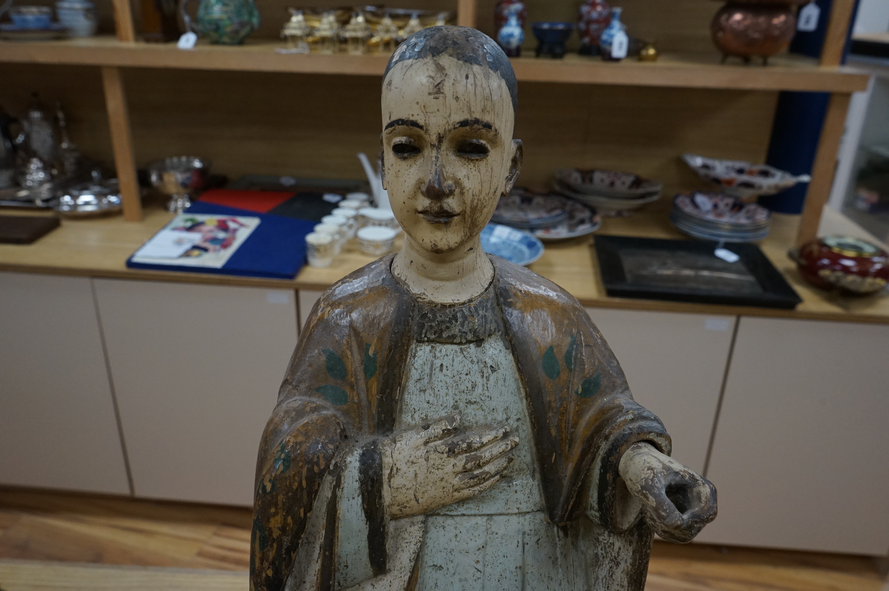 An 18th century Continental polychrome painted wooden religious figure, 64cm high. Condition - paint worn